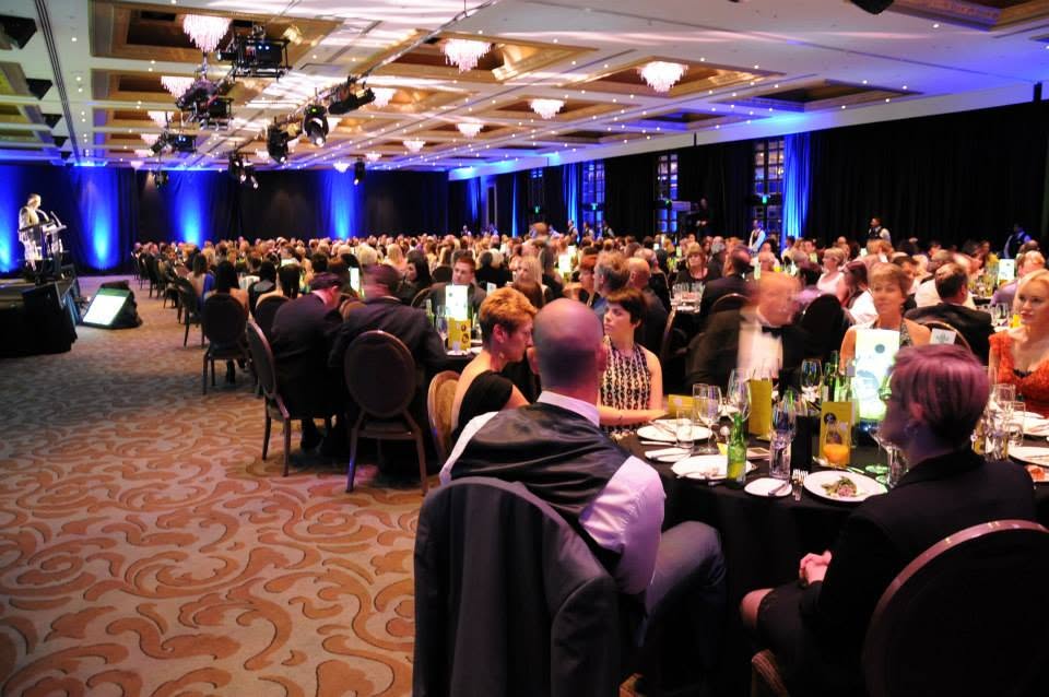 Formal awards dinner with guests seated in a ballroom